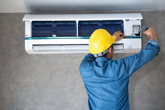 AC servicing technician deep cleaning indoor unit in Delhi NCR — EZAC Service